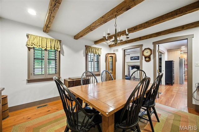 1423 Emily Ln, Festus, MO 63028 - dining area featuring light wood-style flooring, beamed ceiling, recessed lighting, and a chandelier