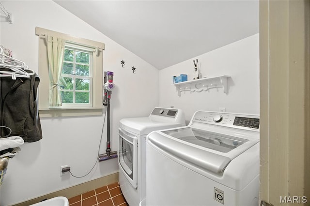1423 Emily Ln, Festus, MO 63028 - washroom with washer and clothes dryer and dark tile patterned flooring
