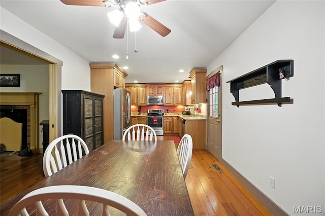 1423 Emily Ln, Festus, MO 63028 - dining space with a ceiling fan, light wood finished floors, and recessed lighting