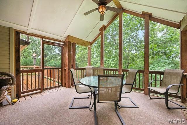 1423 Emily Ln, Festus, MO 63028 - sunroom / solarium with a ceiling fan, vaulted ceiling, carpet, and outdoor dining space