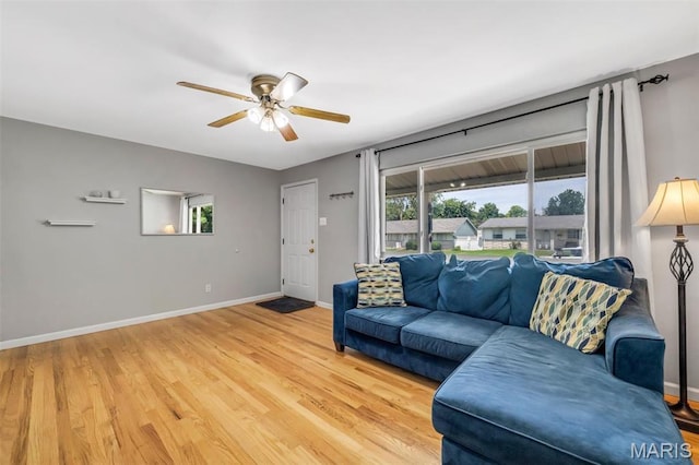 12006 Glengrove Dr, Maryland Heights, MO 63043 - living area with ceiling fan and light wood-type flooring