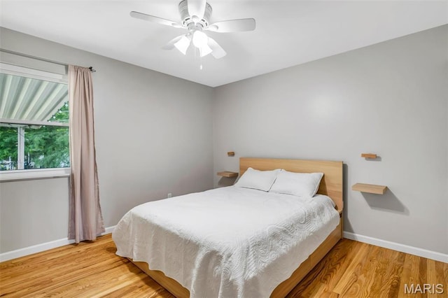 12006 Glengrove Dr, Maryland Heights, MO 63043 - bedroom featuring wood finished floors and a ceiling fan