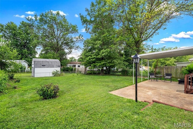 12006 Glengrove Dr, Maryland Heights, MO 63043 - fenced backyard with a patio area and a storage shed