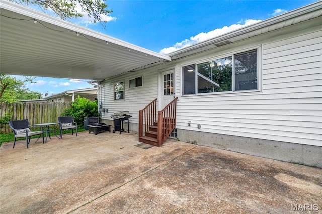 12006 Glengrove Dr, Maryland Heights, MO 63043 - view of patio with entry steps and a grill