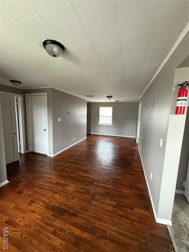 711 E Gladys St, Sikeston, MO 63801 - empty room with wood finished floors