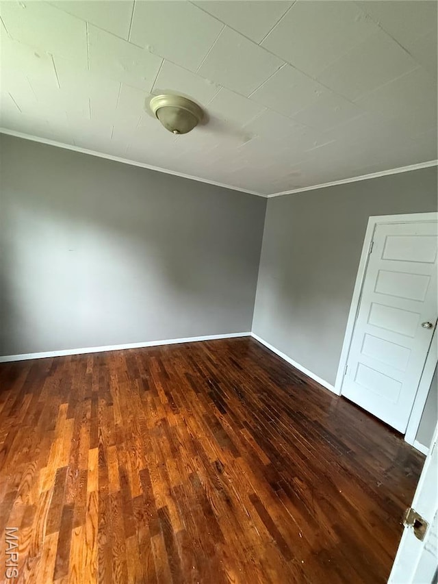 711 E Gladys St, Sikeston, MO 63801 - spare room with ornamental molding and dark wood finished floors