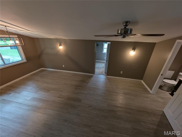 326 S Elm St, Bethalto, IL 62010 - empty room with ceiling fan, baseboards, and wood finished floors