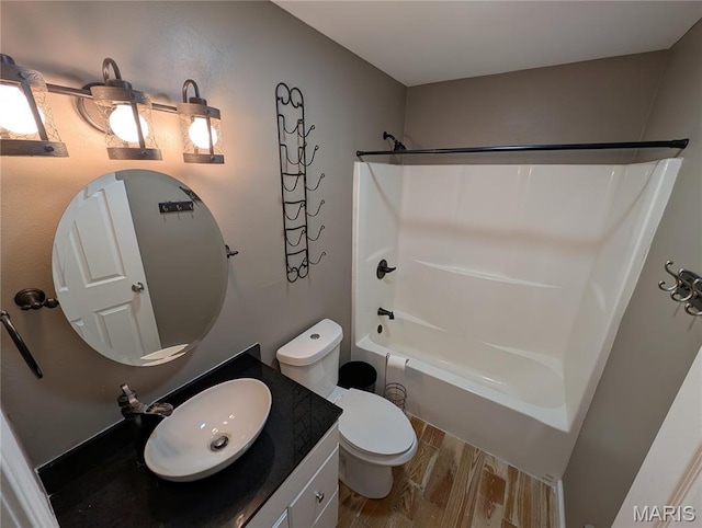 326 S Elm St, Bethalto, IL 62010 - bathroom featuring bathing tub / shower combination, wood finished floors, vanity, and toilet