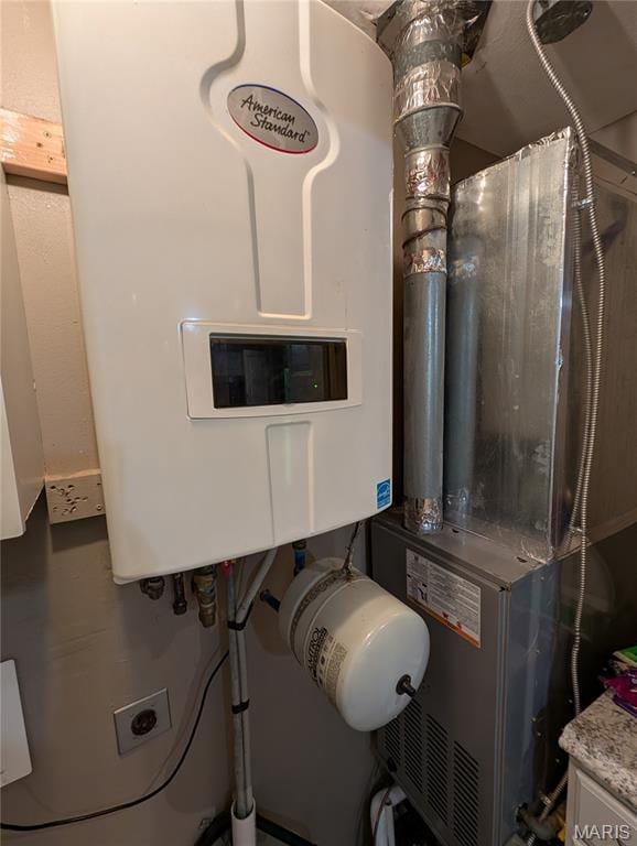 326 S Elm St, Bethalto, IL 62010 - utility room featuring tankless water heater