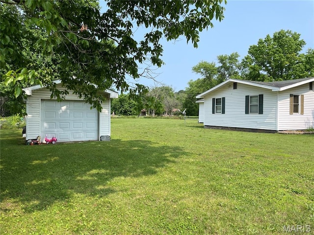 402 Legion Park Rd, Piedmont, MO 63957 - view of green lawn featuring a garage and an outbuilding