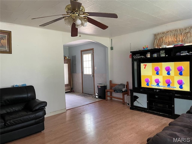 402 Legion Park Rd, Piedmont, MO 63957 - living area featuring arched walkways, ceiling fan, and wood finished floors