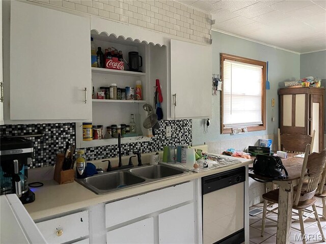 402 Legion Park Rd, Piedmont, MO 63957 - kitchen featuring dishwasher, a sink, light countertops, white cabinetry, and crown molding