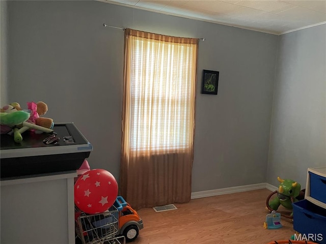 402 Legion Park Rd, Piedmont, MO 63957 - game room with wood finished floors, crown molding, and baseboards