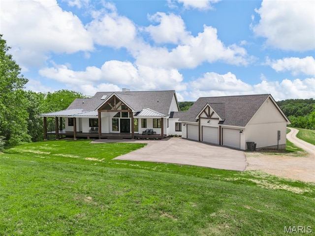 22206 Tree Farm Rd, Hermann, MO 63383 - rear view of house with driveway, a garage, a lawn, and roof with shingles