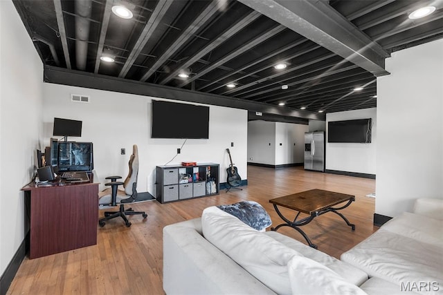 22206 Tree Farm Rd, Hermann, MO 63383 - living room with baseboards, wood finished floors, and an office area