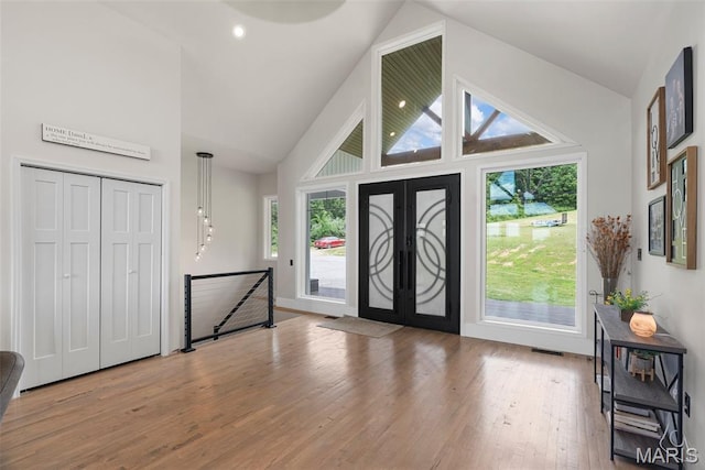 22206 Tree Farm Rd, Hermann, MO 63383 - foyer with wood finished floors and high vaulted ceiling