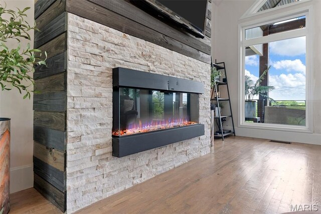22206 Tree Farm Rd, Hermann, MO 63383 - detailed view of a stone fireplace and wood finished floors