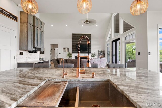 22206 Tree Farm Rd, Hermann, MO 63383 - kitchen with light stone countertops, hanging light fixtures, and recessed lighting