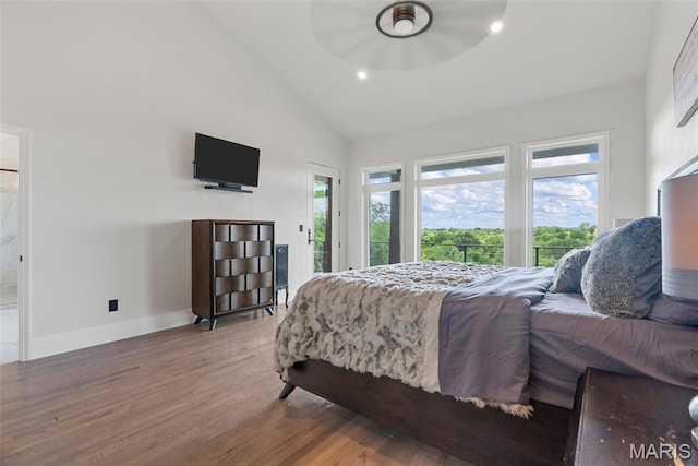 22206 Tree Farm Rd, Hermann, MO 63383 - bedroom with access to exterior, wood finished floors, baseboards, recessed lighting, and high vaulted ceiling