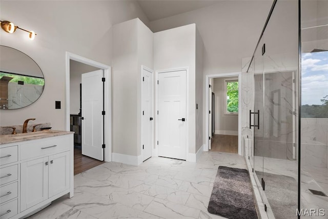22206 Tree Farm Rd, Hermann, MO 63383 - full bath with vanity, marble finish floors, a marble finish shower, and baseboards