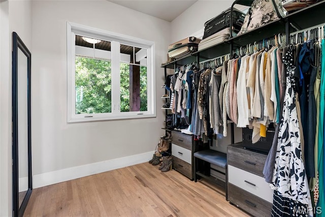 22206 Tree Farm Rd, Hermann, MO 63383 - walk in closet featuring wood finished floors