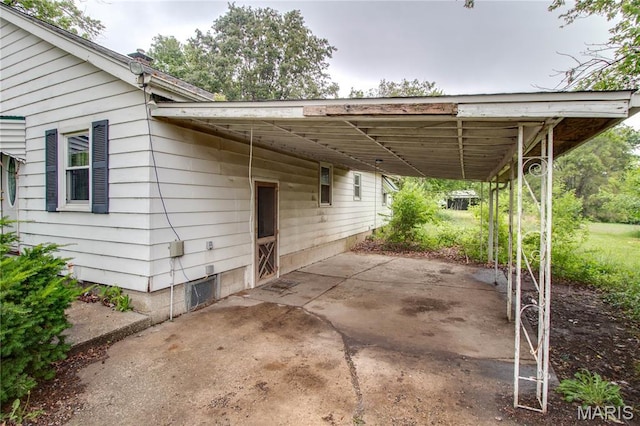 33974 Irish Ln, Brighton, IL 62012 - view of car parking featuring an attached carport and concrete driveway