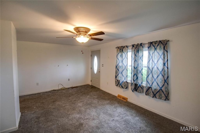33974 Irish Ln, Brighton, IL 62012 - entryway featuring a ceiling fan and dark carpet