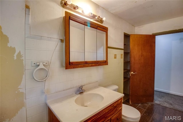 33974 Irish Ln, Brighton, IL 62012 - bathroom featuring tile walls, vanity, and wood finished floors