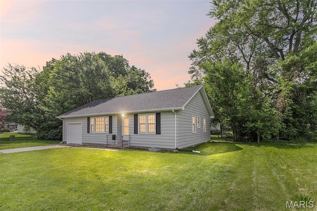 420 E Hauser St, Litchfield, IL 62056 - view of front of property with driveway, a garage, and a yard