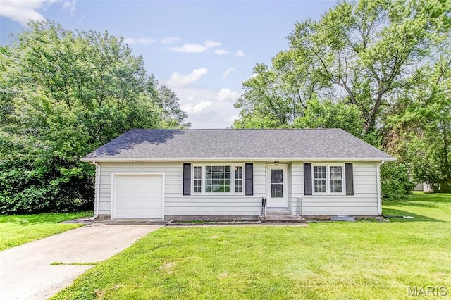420 E Hauser St, Litchfield, IL 62056 - view of front of house featuring an attached garage, driveway, and a front yard