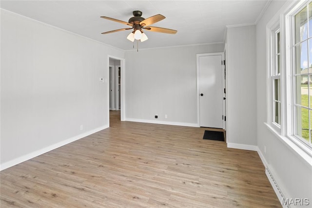 420 E Hauser St, Litchfield, IL 62056 - unfurnished room with crown molding, light wood-type flooring, a ceiling fan, and baseboards