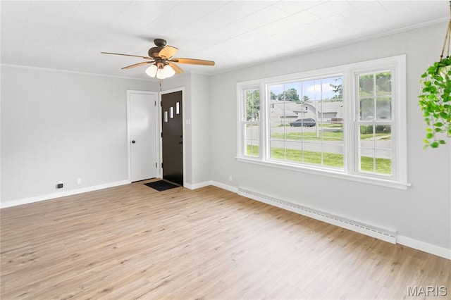 420 E Hauser St, Litchfield, IL 62056 - entryway with a baseboard heating unit, light wood-style floors, crown molding, baseboards, and ceiling fan