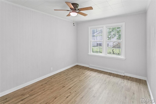 420 E Hauser St, Litchfield, IL 62056 - spare room with a baseboard radiator, light wood finished floors, ornamental molding, ceiling fan, and baseboards