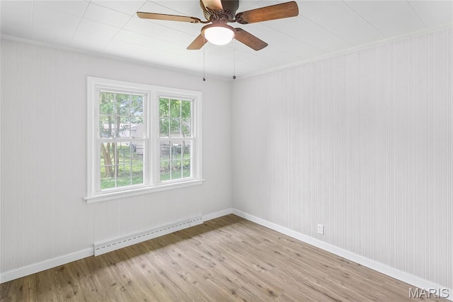 420 E Hauser St, Litchfield, IL 62056 - unfurnished room with baseboard heating, light wood-type flooring, a ceiling fan, baseboards, and ornamental molding
