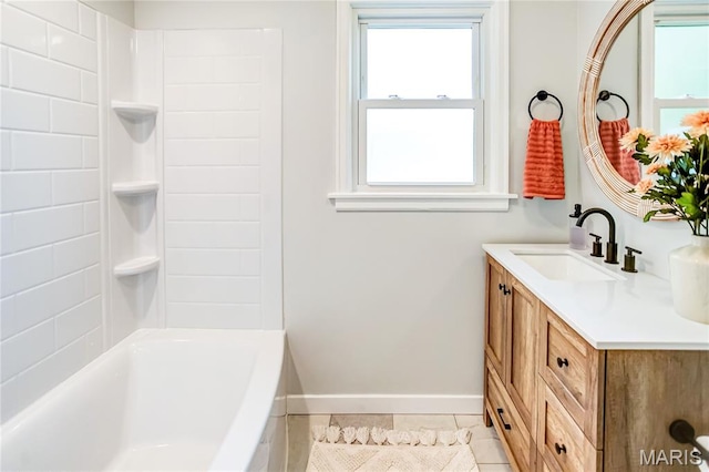 420 E Hauser St, Litchfield, IL 62056 - full bath with vanity, tile patterned flooring, baseboards, and shower / bath combination