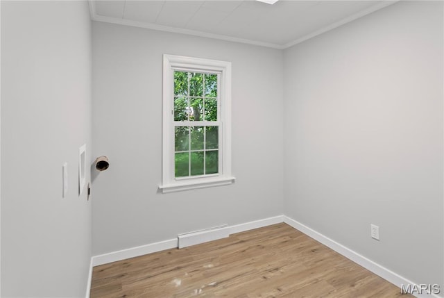 420 E Hauser St, Litchfield, IL 62056 - spare room featuring ornamental molding, baseboards, and light wood-type flooring