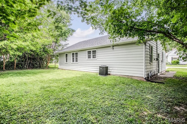 420 E Hauser St, Litchfield, IL 62056 - back of house with a lawn and central AC
