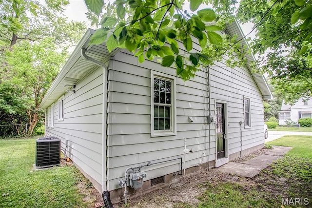 420 E Hauser St, Litchfield, IL 62056 - view of property exterior featuring cooling unit and a yard