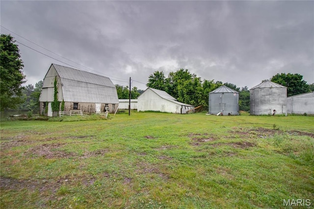 33425 Irish Ln, Brighton, IL 62012 - view of green lawn with a barn and an outbuilding