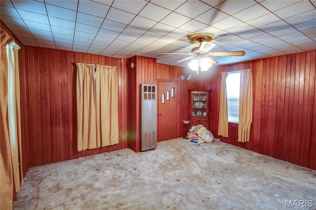 33425 Irish Ln, Brighton, IL 62012 - unfurnished room with carpet, a ceiling fan, and wood walls