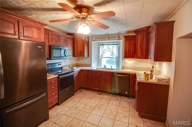 33425 Irish Ln, Brighton, IL 62012 - kitchen featuring appliances with stainless steel finishes, light countertops, a ceiling fan, brown cabinetry, and light tile patterned floors