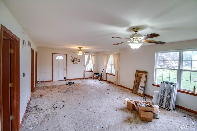 33425 Irish Ln, Brighton, IL 62012 - unfurnished living room featuring ceiling fan and carpet floors