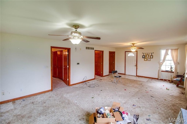 33425 Irish Ln, Brighton, IL 62012 - unfurnished living room with ceiling fan and light carpet