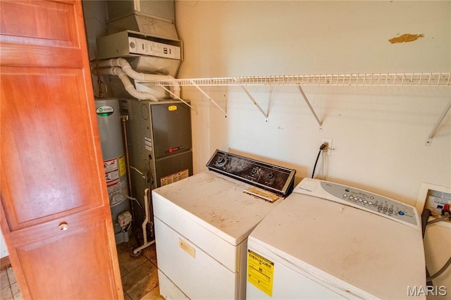 33425 Irish Ln, Brighton, IL 62012 - laundry room with washer and clothes dryer and water heater