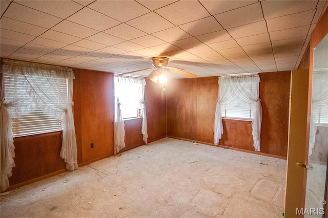 33425 Irish Ln, Brighton, IL 62012 - empty room featuring wood walls, carpet, and ceiling fan