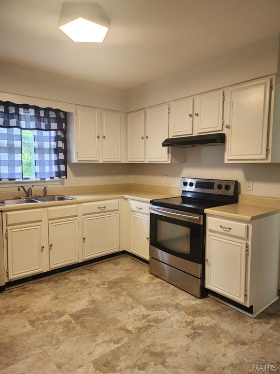 108 Auburn Dr, Waynesville, MO 65583 - kitchen featuring electric stove, under cabinet range hood, a sink, white cabinetry, and light countertops