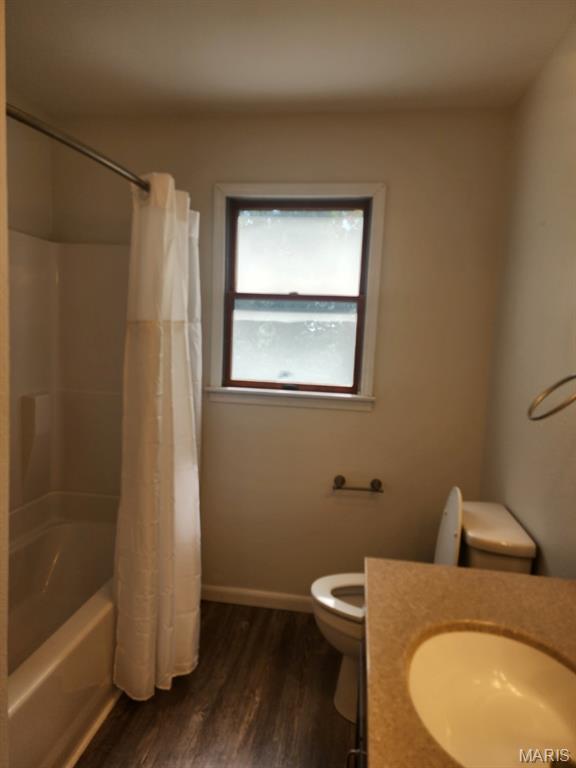 108 Auburn Dr, Waynesville, MO 65583 - full bathroom featuring toilet, vanity, wood finished floors, and shower / tub combo