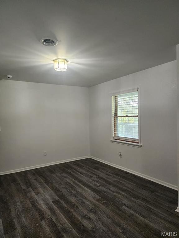 108 Auburn Dr, Waynesville, MO 65583 - empty room with dark wood-type flooring and baseboards