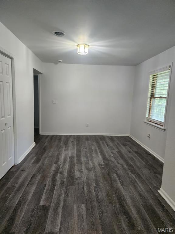 108 Auburn Dr, Waynesville, MO 65583 - empty room featuring dark wood-style flooring and baseboards
