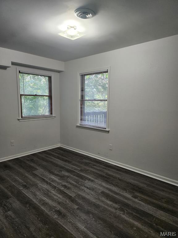 108 Auburn Dr, Waynesville, MO 65583 - unfurnished room featuring dark wood-style flooring and baseboards